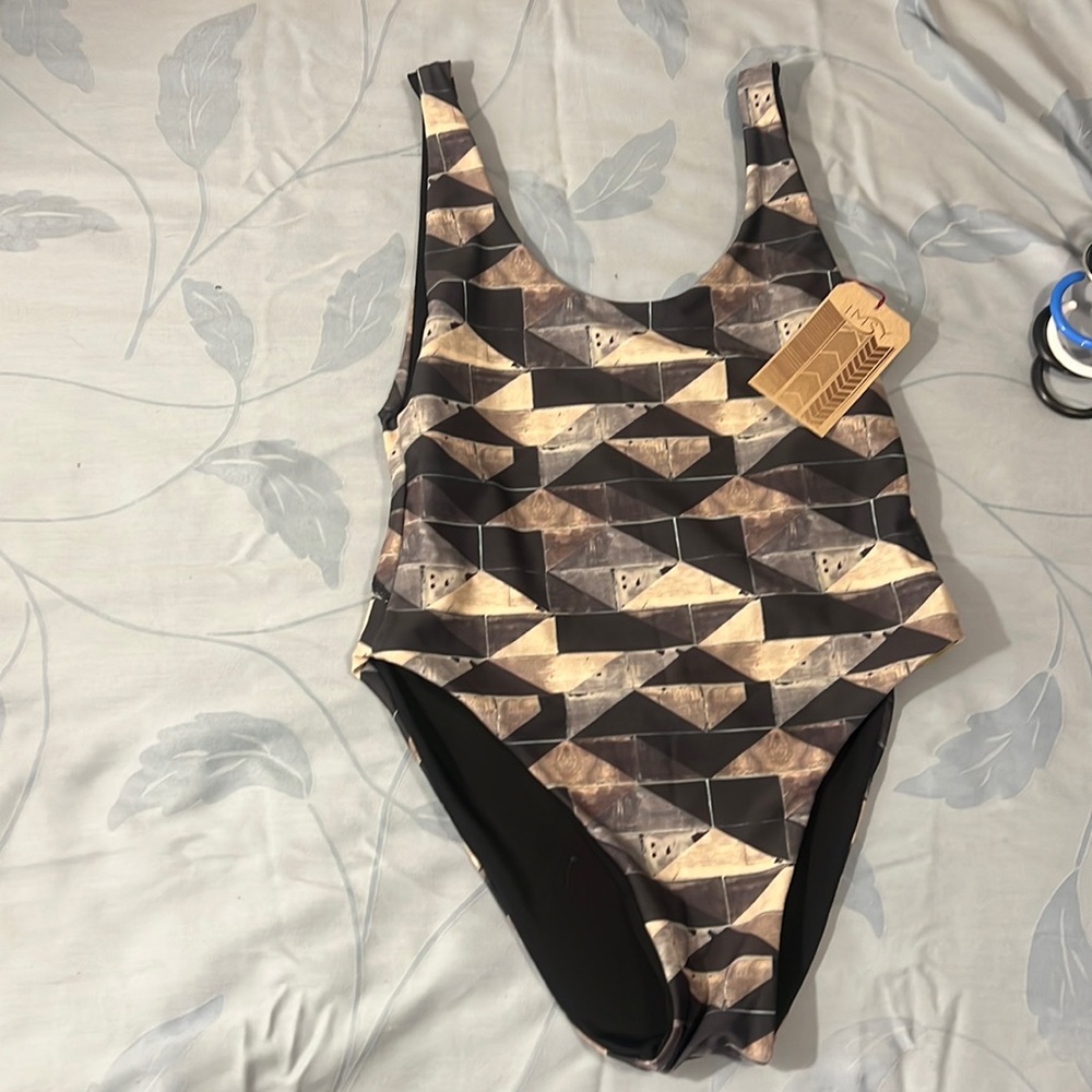 Low back reversible black and sage, black, tan tile print solid black one piece